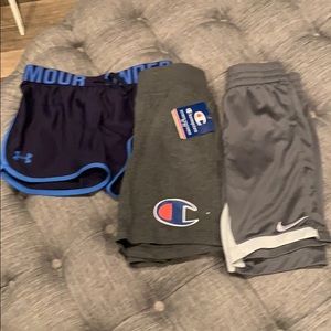 3 girls shirts: UA, Nike, Champion, size small